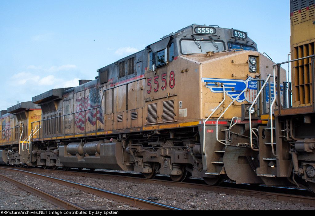 UP 5558 trails on a westbound manifest